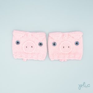 Bandes circulaires de 8cm de haut sur 11cm de large, réalisées au tricot par Plic et représentant la tête d'un cochon.